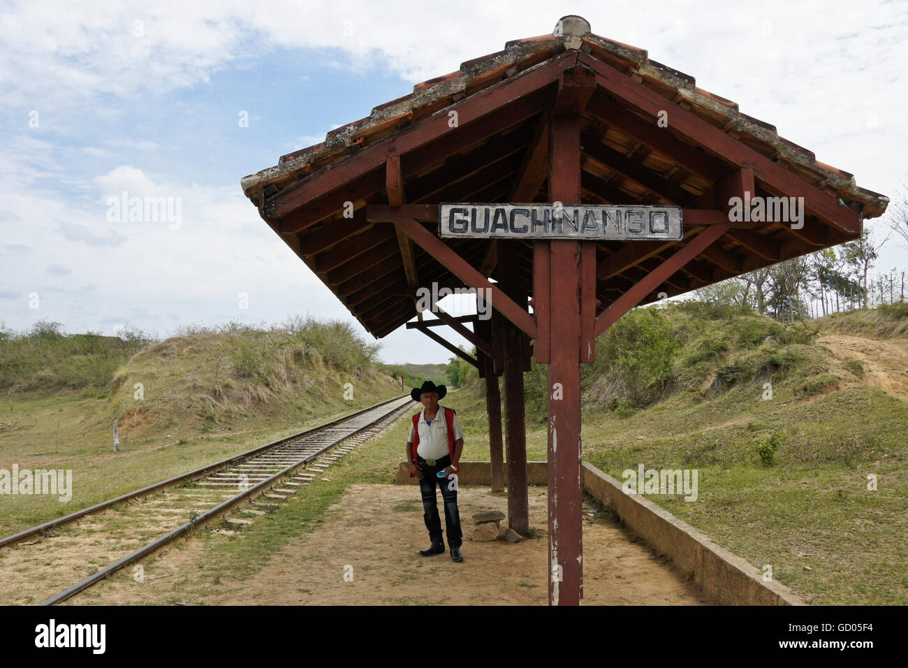 Man waiting for a train at the stop in Guachinango, Valle de los Ingenios (Valley of the Sugar Mills), Trinidad,  Cuba Stock Photo