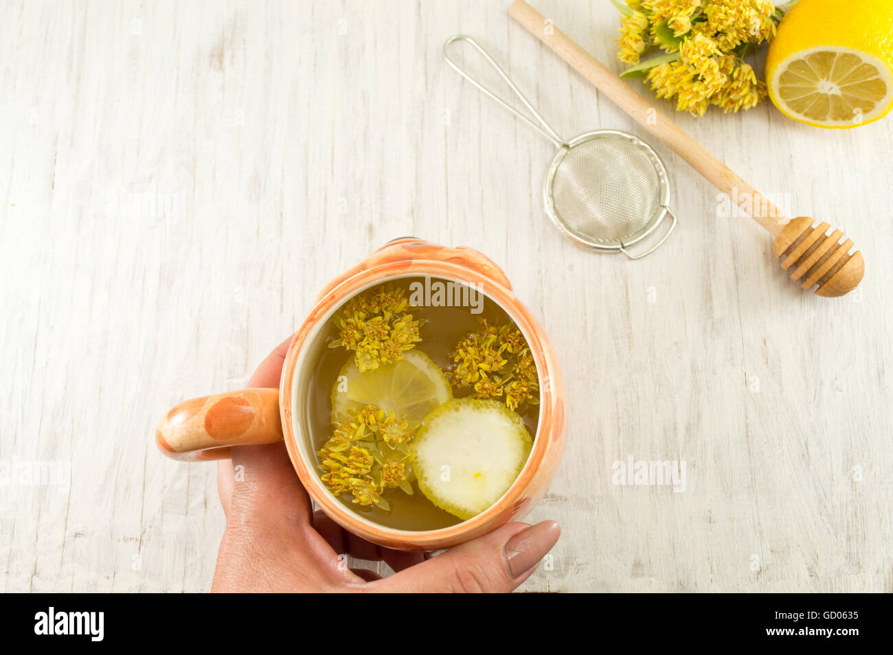 Linden Tea with fresh flowers and lemon served Stock Photo