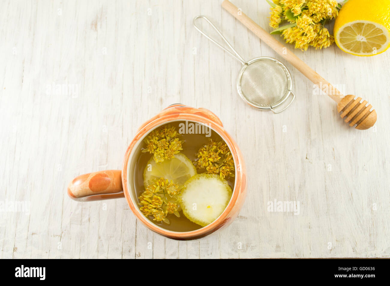 Linden Tea with fresh flowers and lemon served Stock Photo