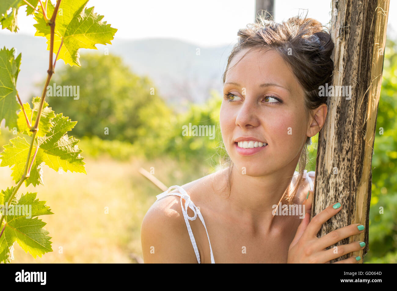 Young beautiful woman portrait in a vineyard Stock Photo