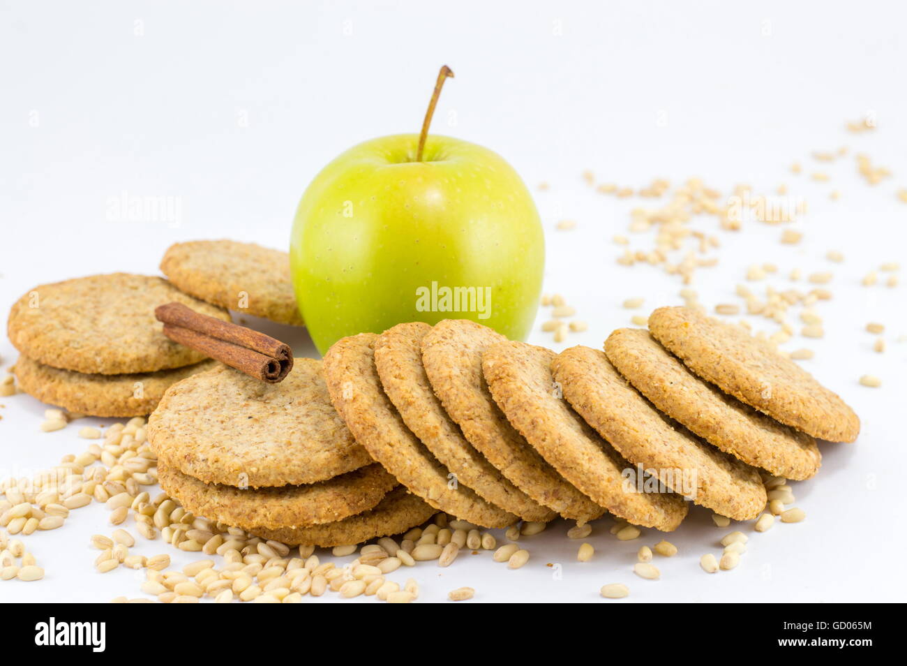 Integral biscuits with apple and wheat seeds on white background Stock Photo