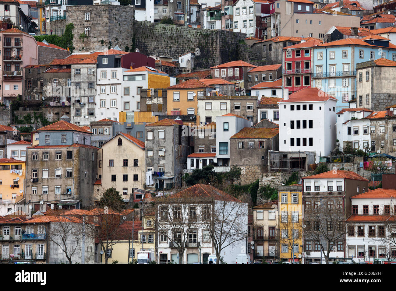 Old houses on steep hillside in city of Porto in Portugal, dense residential development Stock Photo