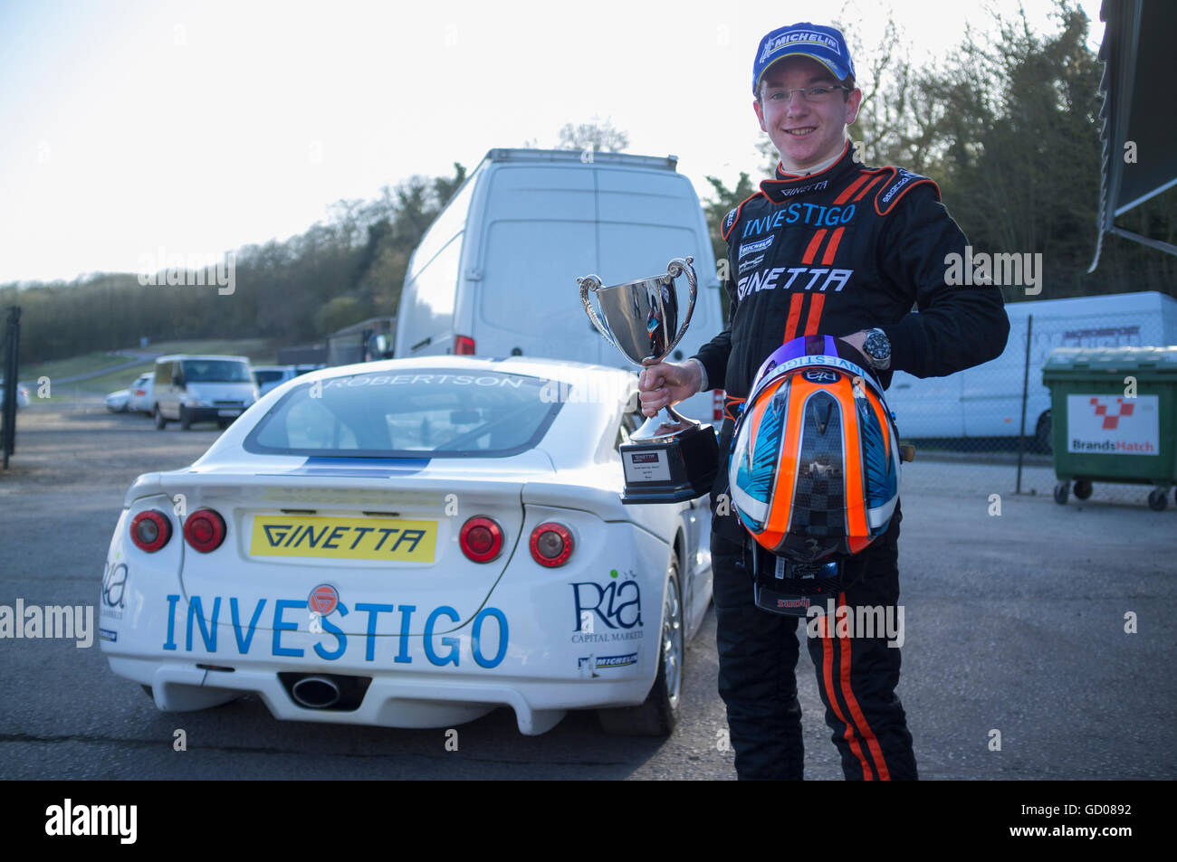 Charlie Robertson holding cup for winning second round of opening race of the 2012 Ginetta Juniors championship at Brands Hatch Stock Photo