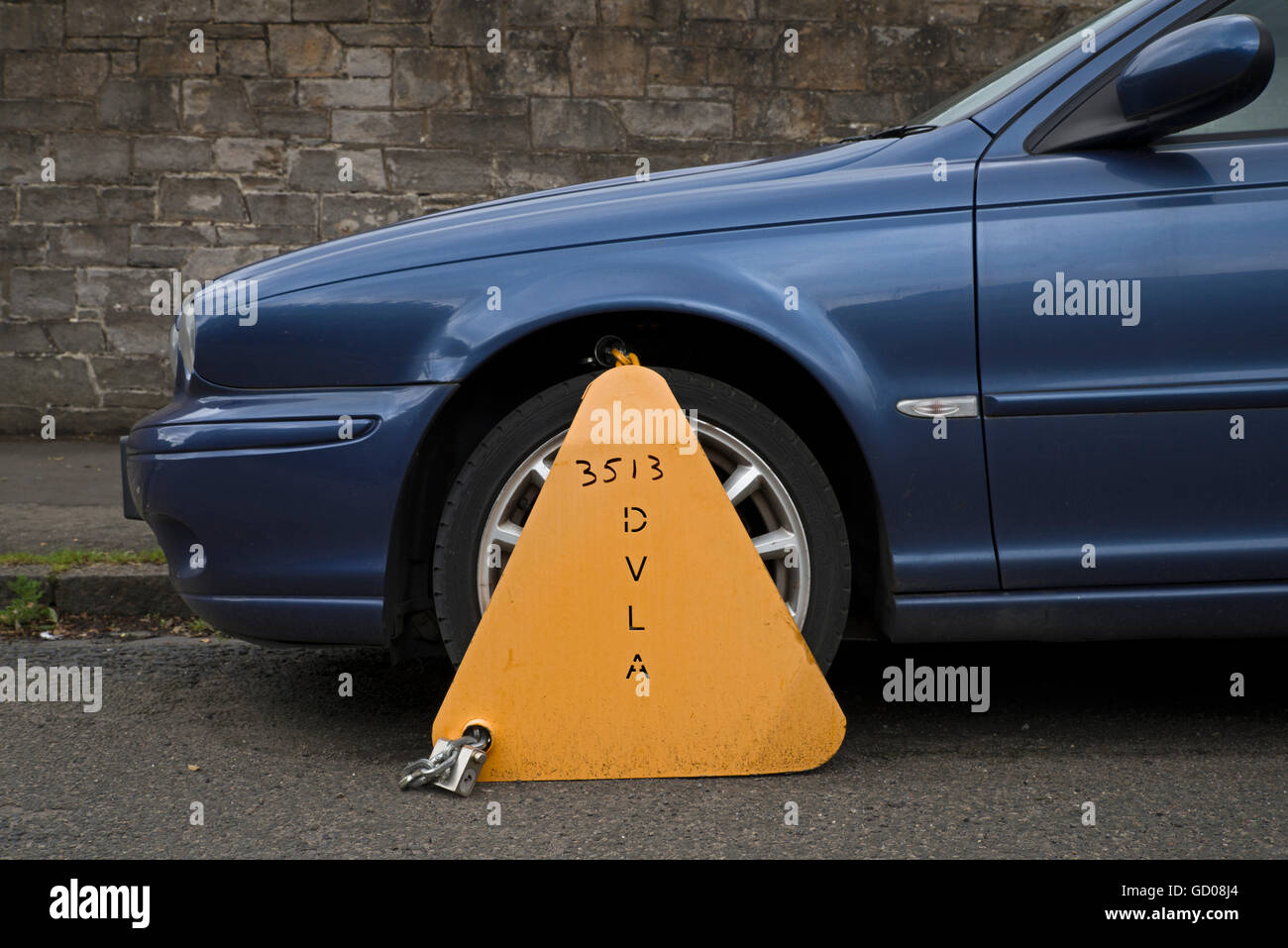 Untaxed car clamped by the DVLA. Stock Photo