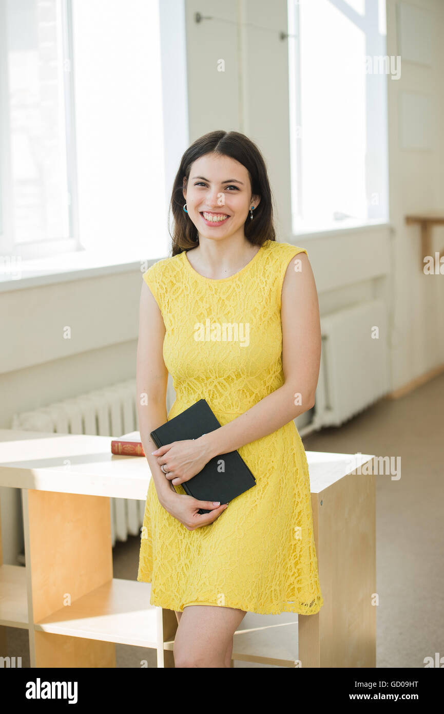 bright picture of smiling student with books Stock Photo - Alamy