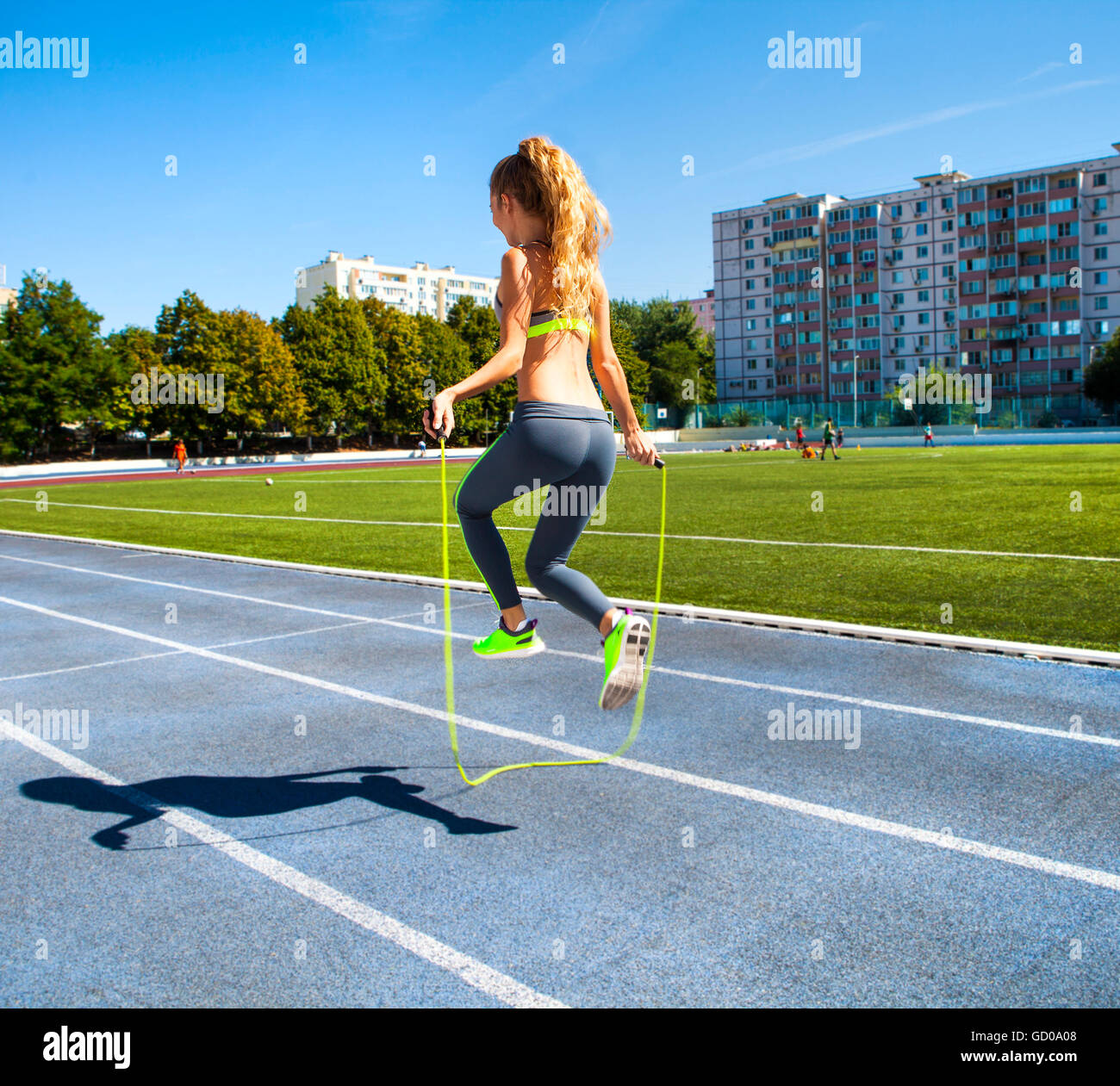 Lady Jump Rope Woman with jumping rope. Beautiful young woman with a jumping rope in ...
