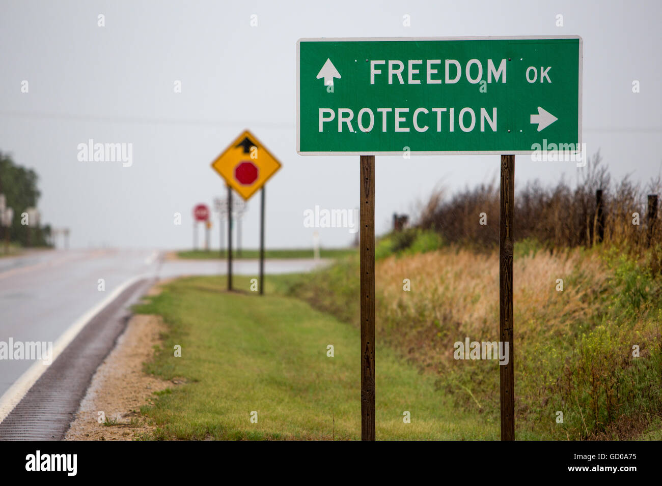 A sign pointing to Freedom or Protection, Oklahoma. Stock Photo