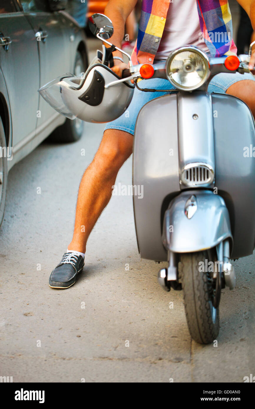 Young man riding moped hi-res stock photography and images - Alamy