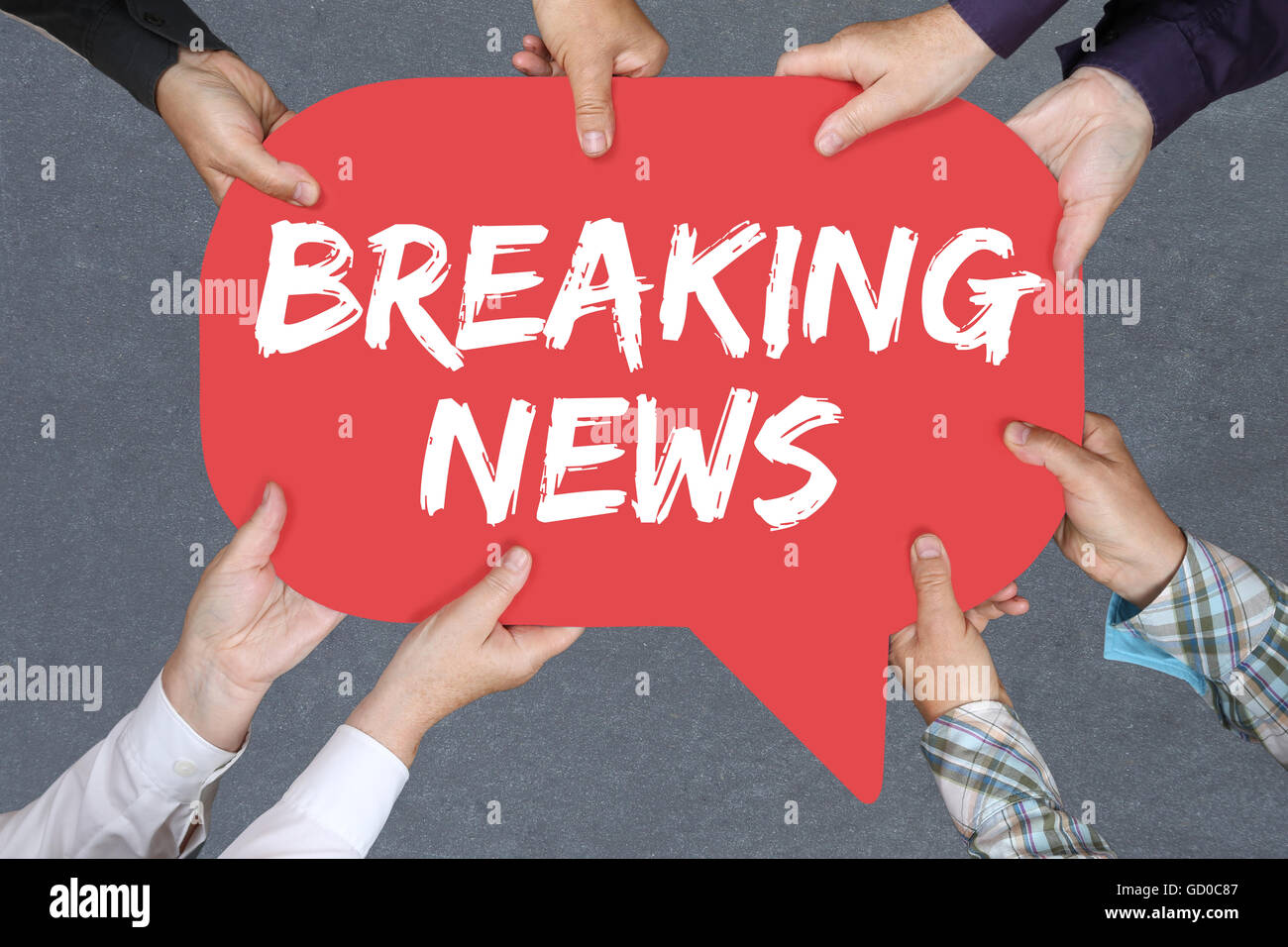 Group of people holding with hands the word Breaking news media announcement announce information Stock Photo
