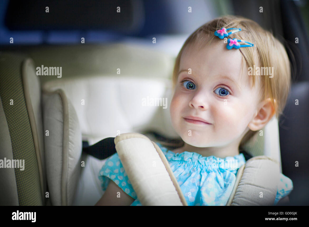 Portrait of a happy little baby girl in the car seat Stock Photo Alamy