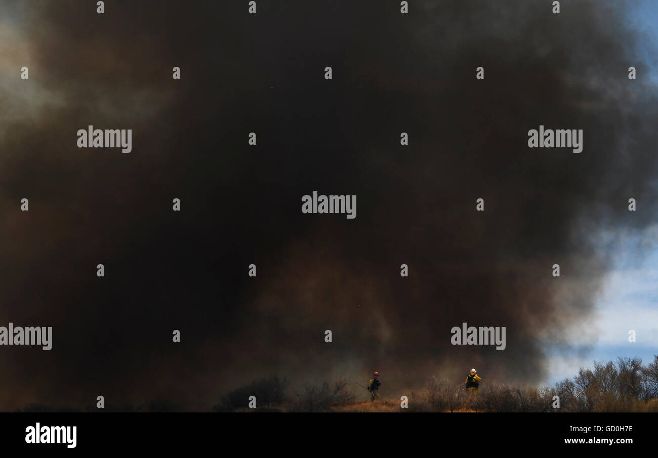 Thick smoke is seen for miles from the I 5 freeway from a 3rd alarm ...