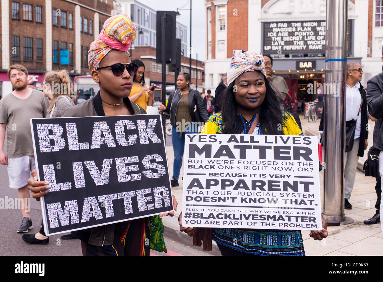 Brixton, London, UK. 9th July 2016. Young protesters holding posters supporting Black Lives Matter. Hundreds of Black Lives Matter Supporters marched on the local police station before a sit-in protest on Brixton High Street which brought London streets to standstill. The march is in response to the fatal shootings of Philando Castile in Minnesota and Alton Sterling in Louisiana. Credit:  Nicola Ferrari/Alamy Live News. Stock Photo