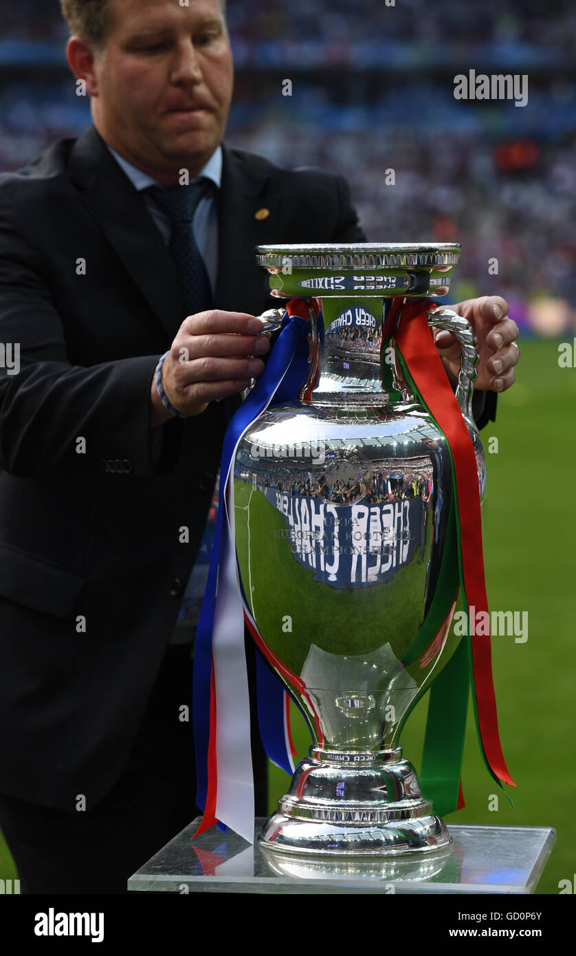 Saint-Denis, France. 10th July, 2016. A man places the trophy of the UEFA EURO  2016, the Coupe Henri Delaunay, before the UEFA EURO 2016 soccer Final  match between Portugal and France at