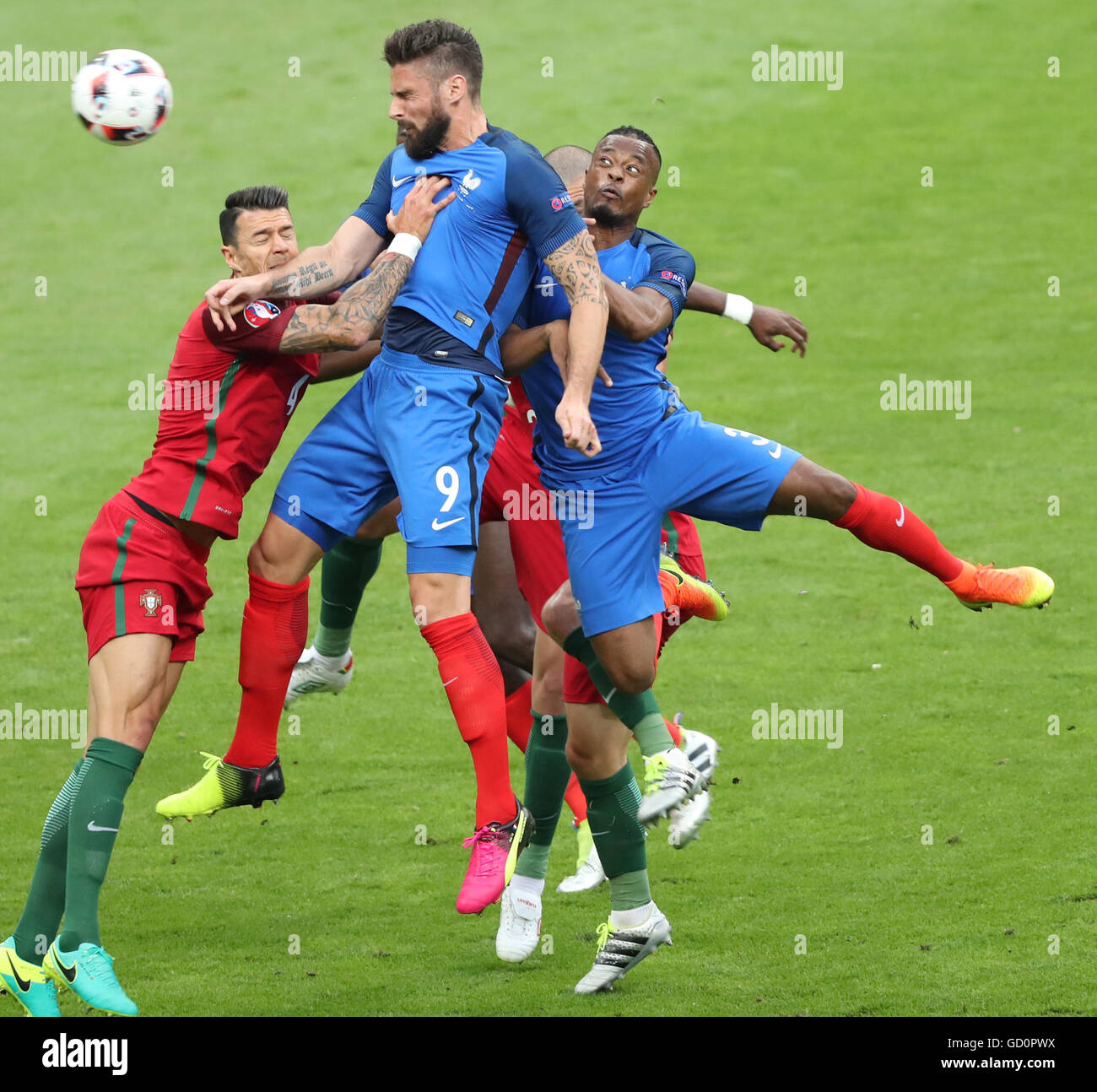 Paris, France. 10th July, 2016. Olivier Giroud (Top) of France competes during the Euro 2016 final football match between Portugal and France in Paris, France, July 10, 2016. © Bai Xuefei/Xinhua/Alamy Live News Stock Photo