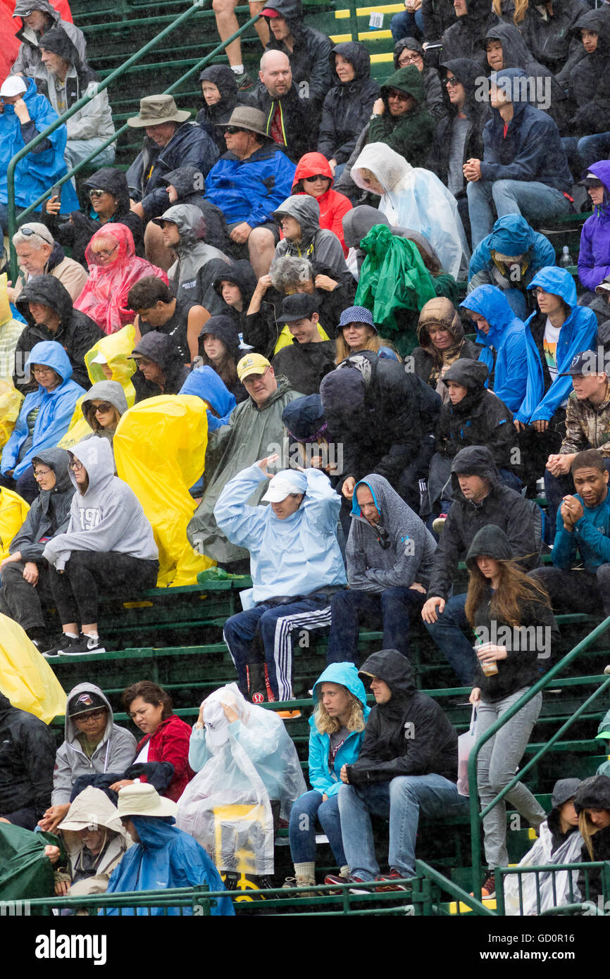 Eugene, USA. 8th July, 2016. Heavy rain with the crowd trying to stay dry at the 2016 USATF Olympic Trials at Historic Hayward Field in Eugene, Oregon, USA. Credit:  Joshua Rainey/Alamy Live News. Stock Photo
