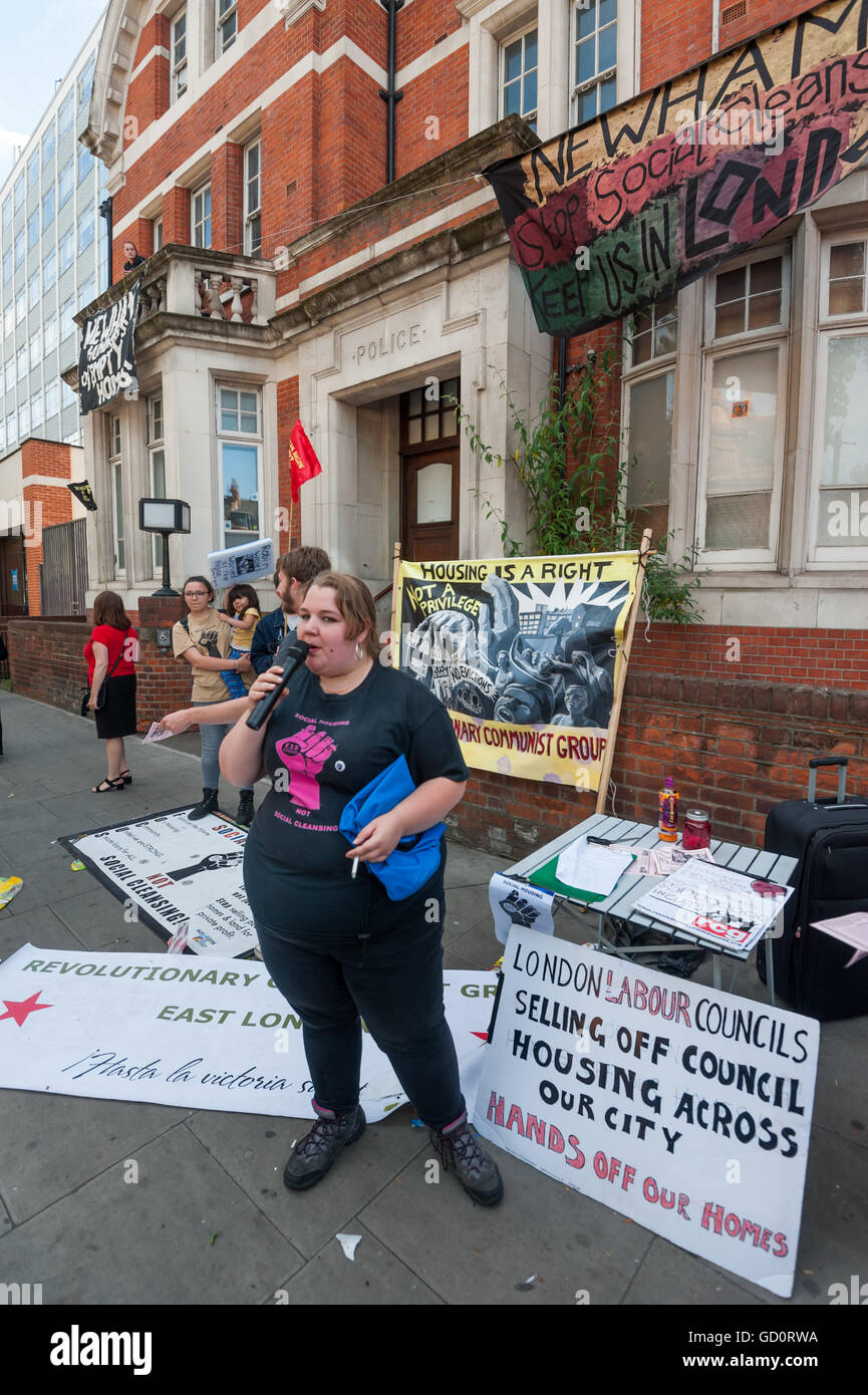 London, UK. 10th July 2016. Housing action group Focus E15 who in previous years have been assaulted and ejected at the Mayor's Newham Show today temporarily occupied the balconies of the former Police Station close to one of the entrances. Jasmin Sotne peaks at the protest they held, against council evictions and the council's failure to provide adequate housing in Newham for long-term residents while hundreds of council homes have been empty for over ten years. Credit:  Peter Marshall/Alamy Live News Stock Photo