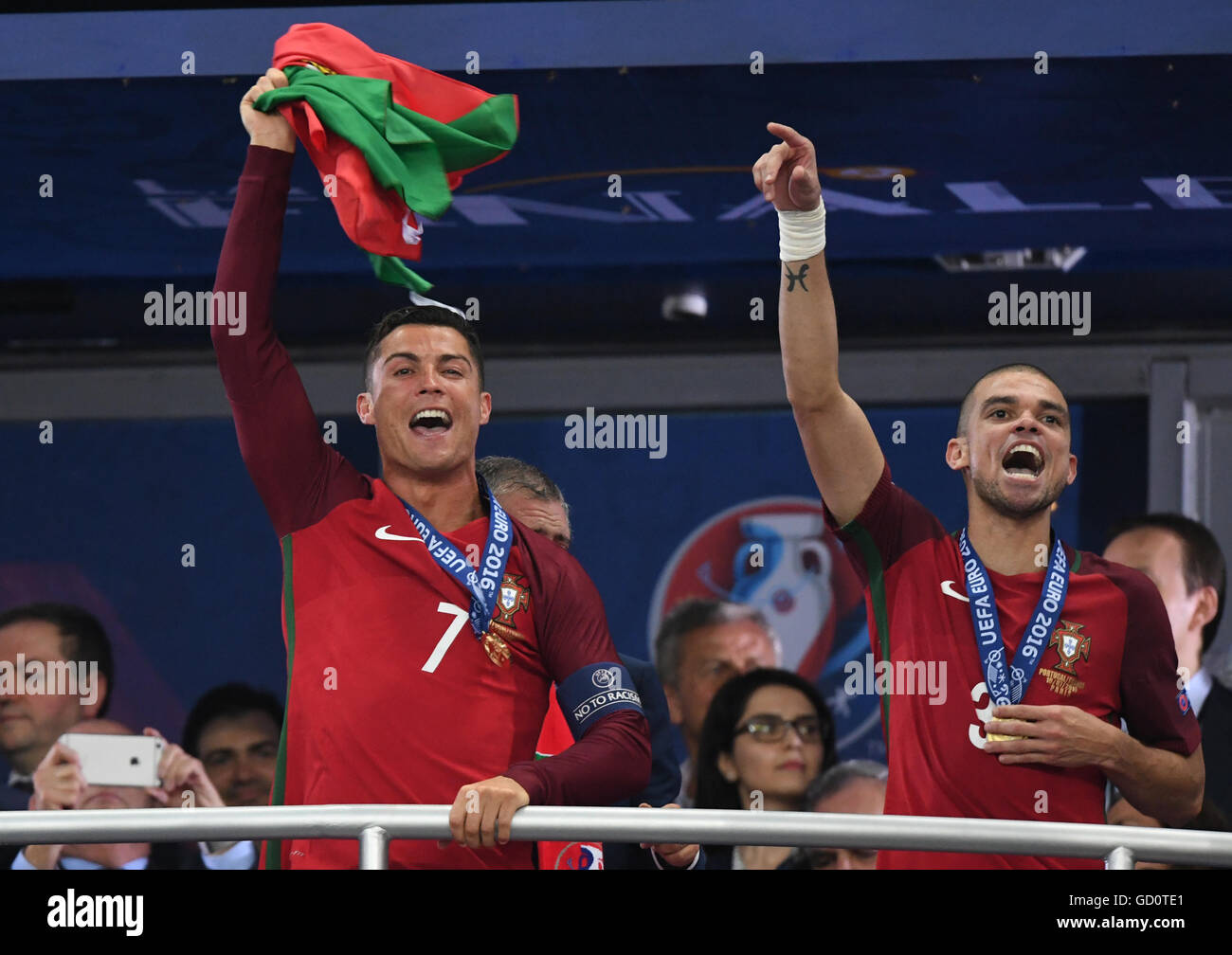 Paris, France. 10th July, 2016. Portugal's Cristiano Ronaldo(L) and Pepe celebrate during the awarding ceremony after winning the Euro 2016 final football match against France in Paris, France, July 10, 2016. Portugal won 1-0. Credit:  Guo Yong/Xinhua/Alamy Live News Stock Photo