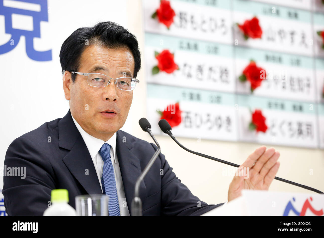 Tokyo, Japan. 10th July, 2016. Wry-faced Katsuya Okada, leader of Japan's main opposition Democratic Party, comments on the early returns of Sunday's upper house election during an interview with a Japanese TV station at the party headquarters in Tokyo on July 10, 2016. The Democrats linked up with three smaller parties including the Japanese Communist Party but failed to gain seats and block the pro-constitutional revision camp from getting a super majority as Prime Minister Shinzo Abe's ruling coalition won a landslide victory. © AFLO/Alamy Live News Stock Photo