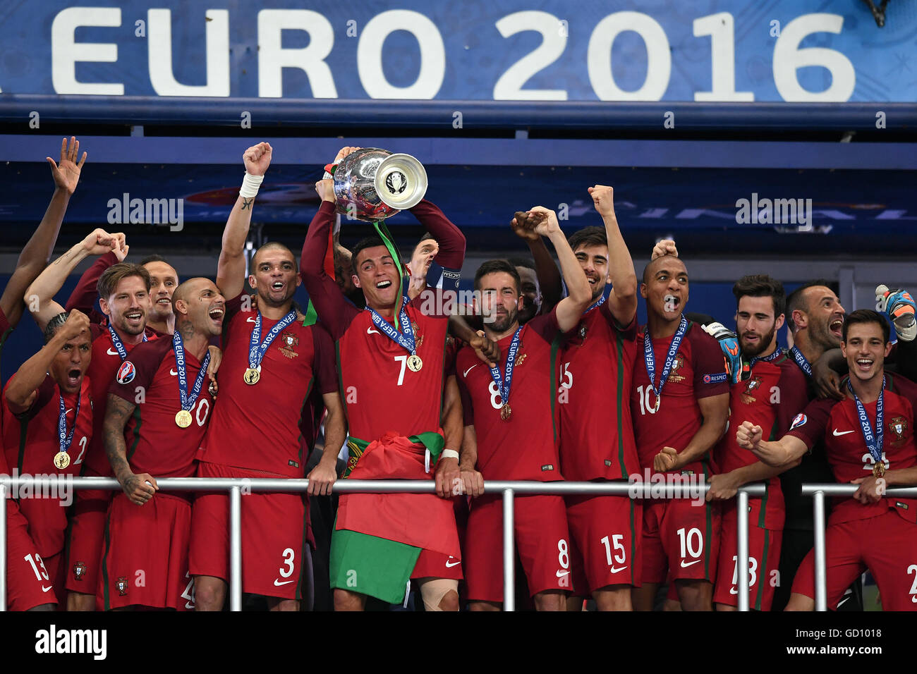 Cristiano Ronaldo (C) of Portugal lifts the trophy after winning the UEFA EURO  2016 soccer Final match between Portugal and France at the Stade de France,  Saint-Denis, France, 10 July 2016. Photo: