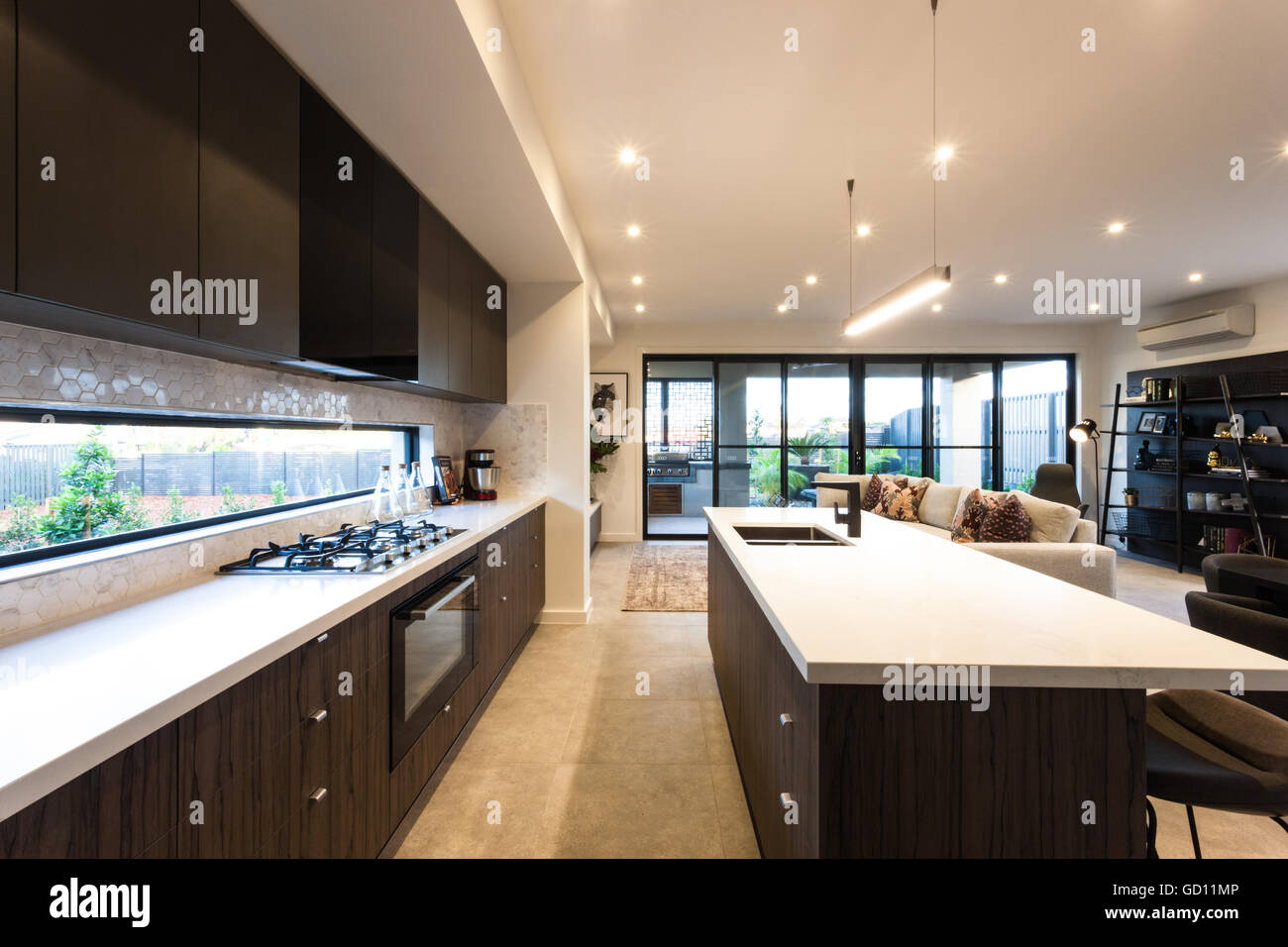 Modern Kitchen Illuminated With Ceiling Lights At Day Time There