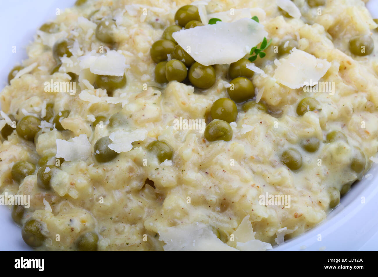 Risotto with green peas and parmesan cheese Stock Photo Alamy