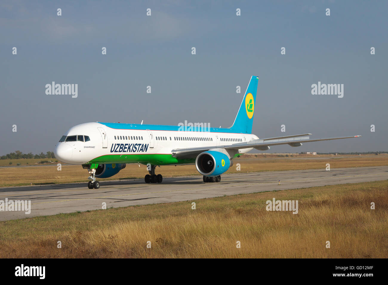 Simferopol, Ukraine - September 13, 2010: Uzbekistan Airways Bowing 757-200 is taxiing along the taxiway in the airport Stock Photo