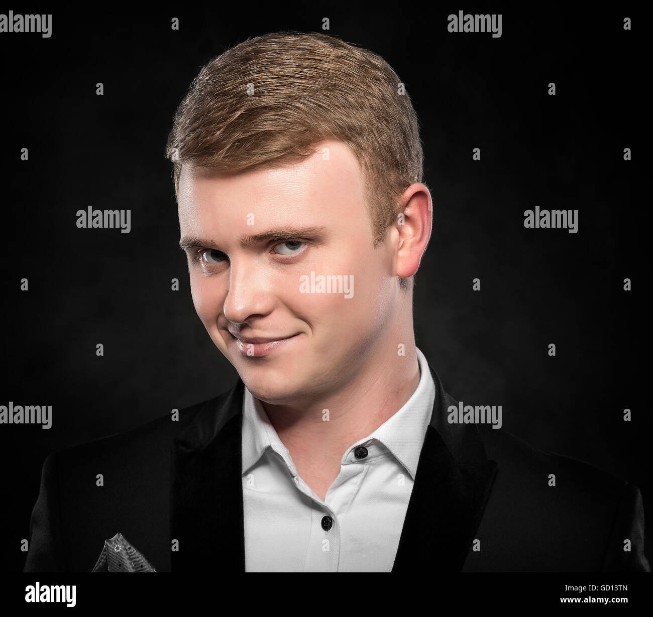 Portrait of a funny man over dark background. Stock Photo