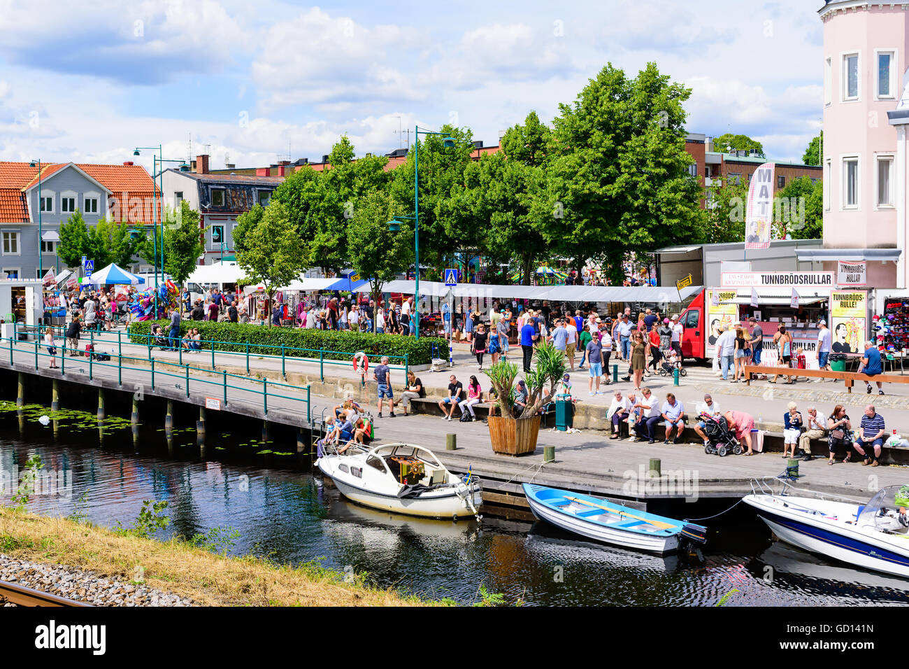 Ronneby, Sweden - July 9, 2016: Big public market day in town with lots of people along the river. Stock Photo