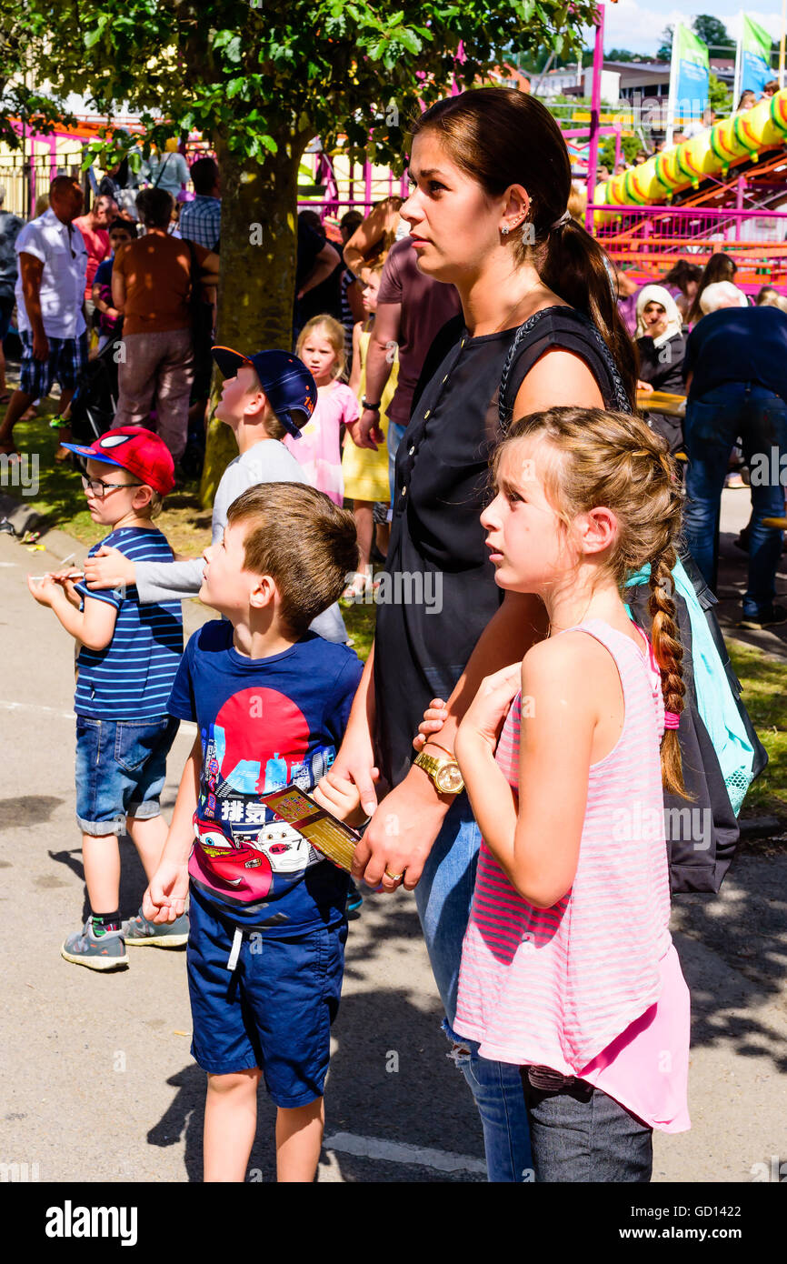 Ronneby, Sweden - July 9, 2016: Big public market day in town with lots of people. Here an attractive woman and some children wa Stock Photo