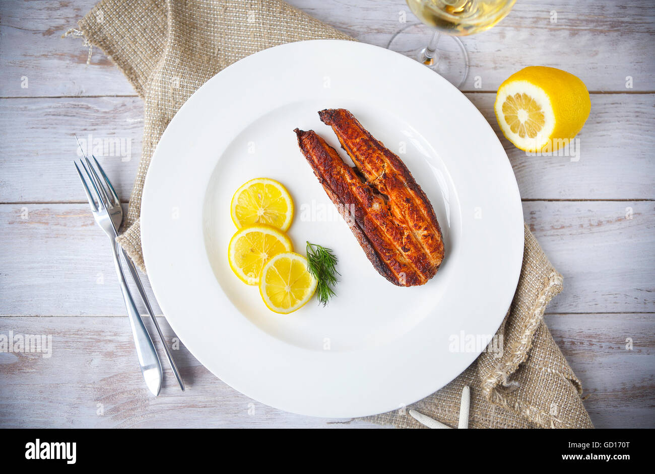 Salmon steak grilled with lemon and white wine. Top view Stock Photo ...