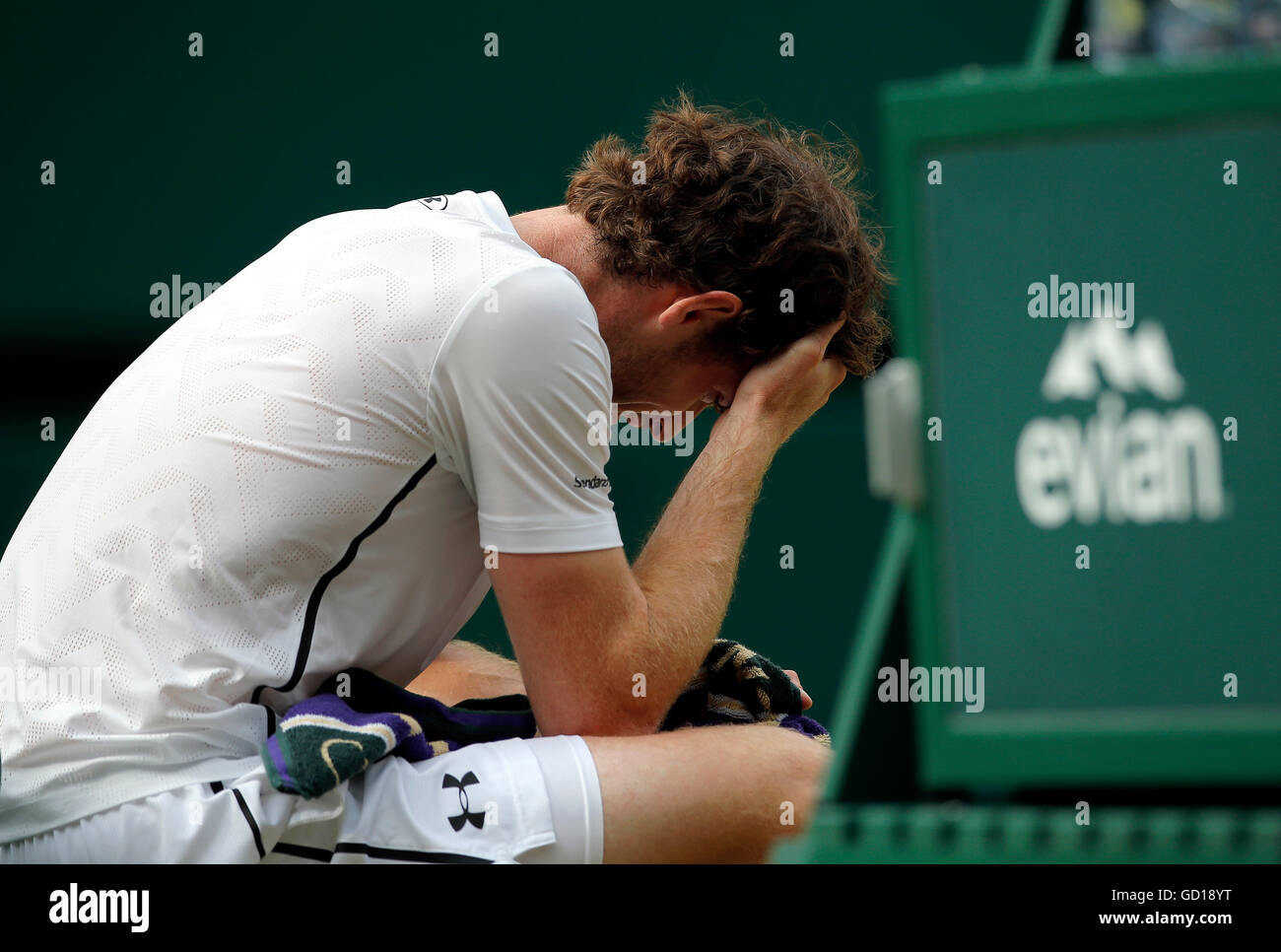 Andy Murray reacts after winning the men's singles final against Milos Raonic on day thirteen of the Wimbledon Championships at the All England Lawn Tennis and Croquet Club, Wimbledon. Stock Photo