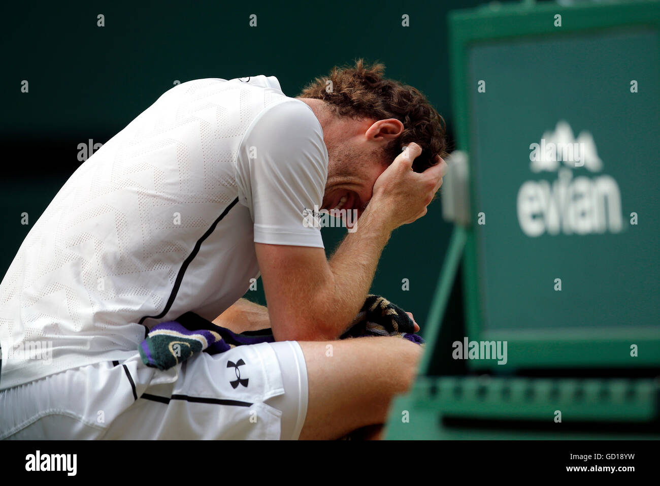 Andy Murray reacts after winning the men's singles final against Milos Raonic on day thirteen of the Wimbledon Championships at the All England Lawn Tennis and Croquet Club, Wimbledon. Stock Photo