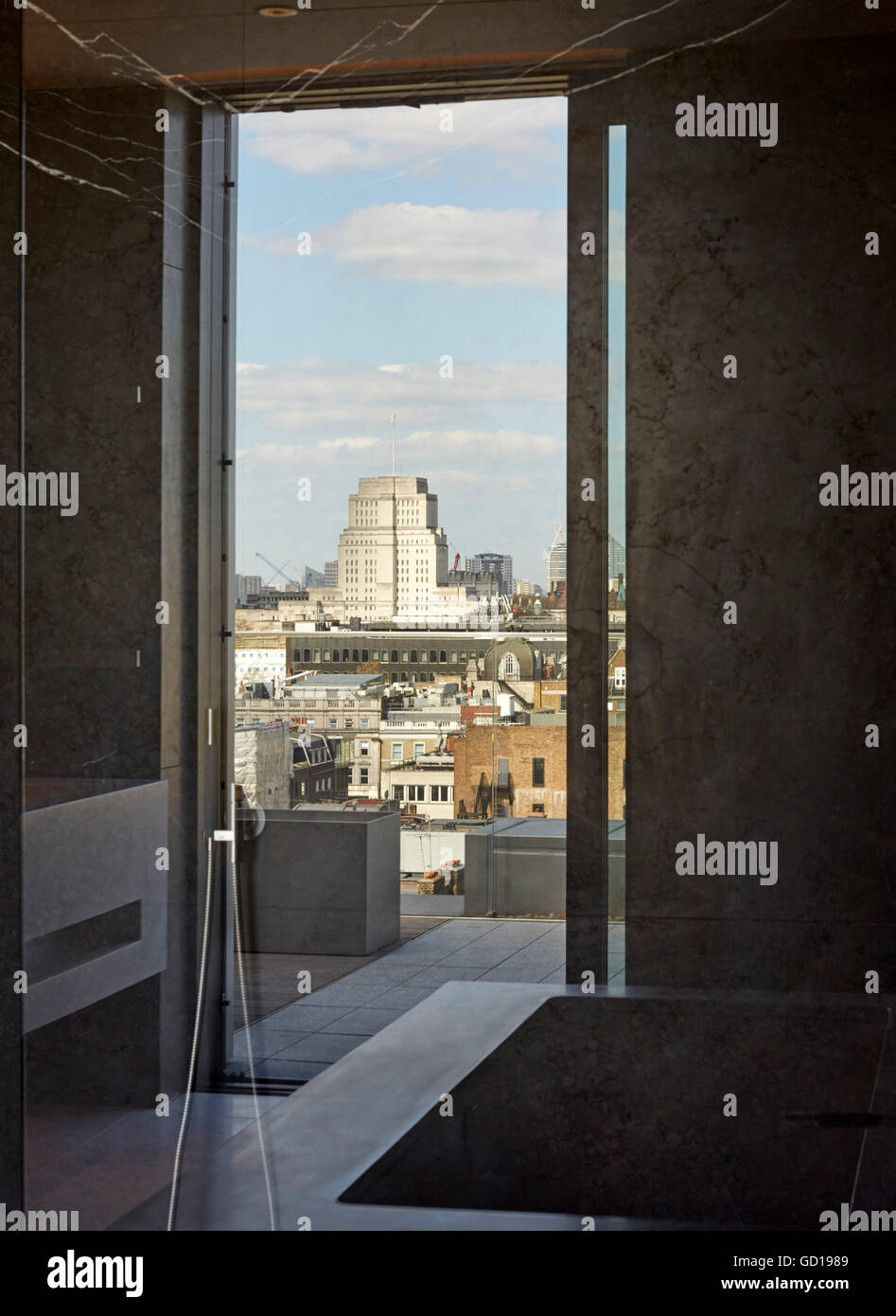 Reflected view in bathroom interior. Fitzroy Place, London, United