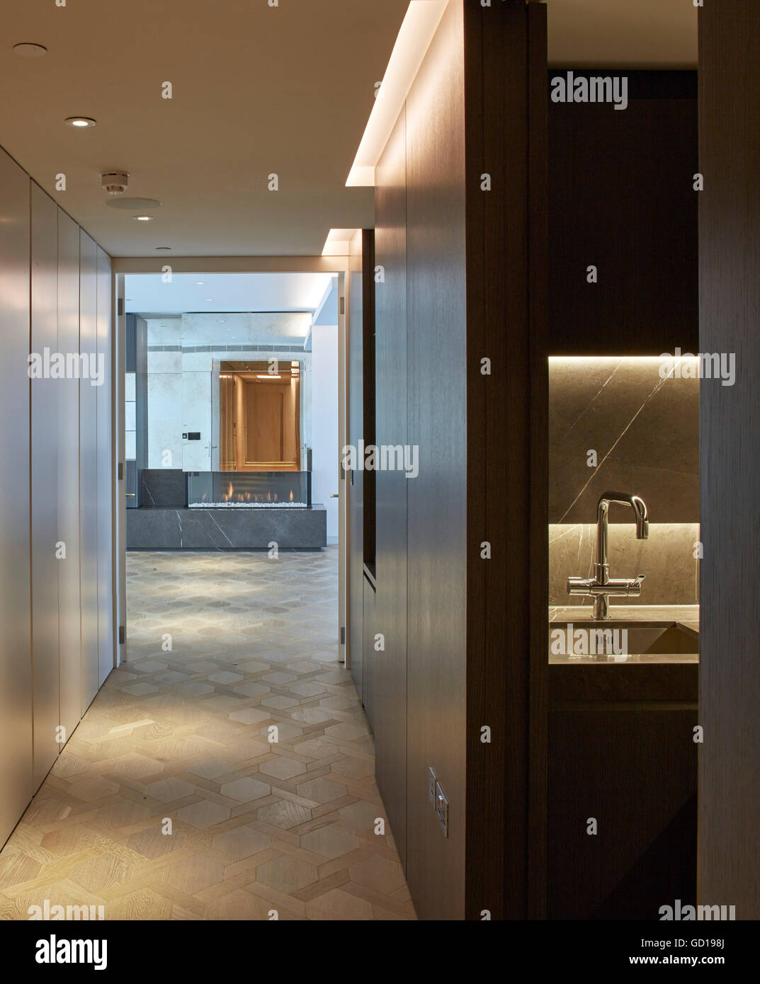 Interior view in penthouse along corridor. Fitzroy Place, London, United Kingdom. Architect