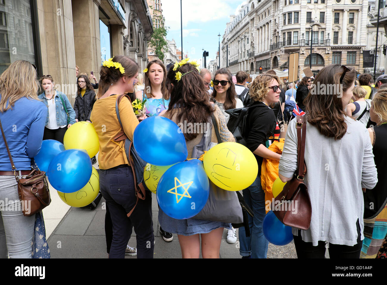 Women with blue yellow balloons at the Anti Brexit demo 'March for Europe' on 2nd July 2016  in London England  KATHY DEWITT Stock Photo