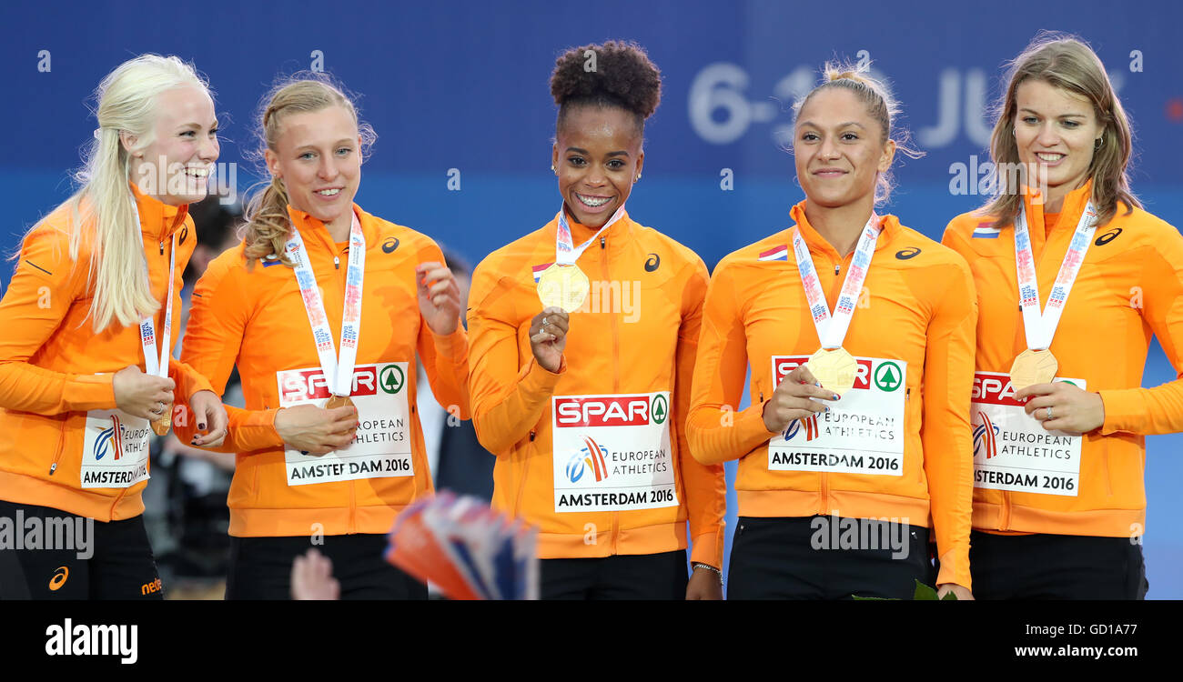 L-R) The Netherland's unknown, Tessa van Schagen, Jamile, Samuel, Naomi  Sedney and Dafne Schippers with their gold medals on the podium after  finishing first in the Women's 4x100m Relay Final in action