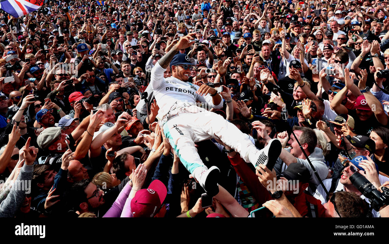 Lewis Hamilton Celebrates His Victory With The Crowd After Winning The lewis-hamilton-celebrates-his-victory-with-the-crowd-after-winning-the