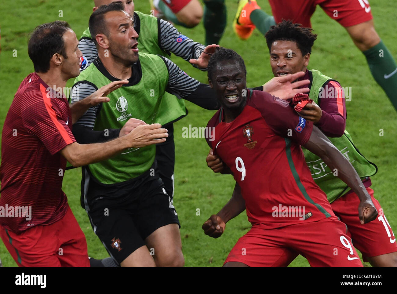 Portugal players celebrate after Eder (second right) scores his side's first goal of the game during the UEFA Euro 2016 Final at the Stade de France, Paris. Stock Photo