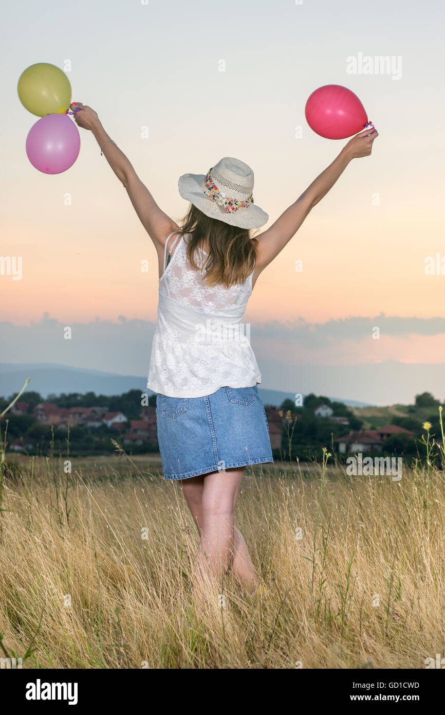 Balloons holding hi-res stock photography and images - Alamy
