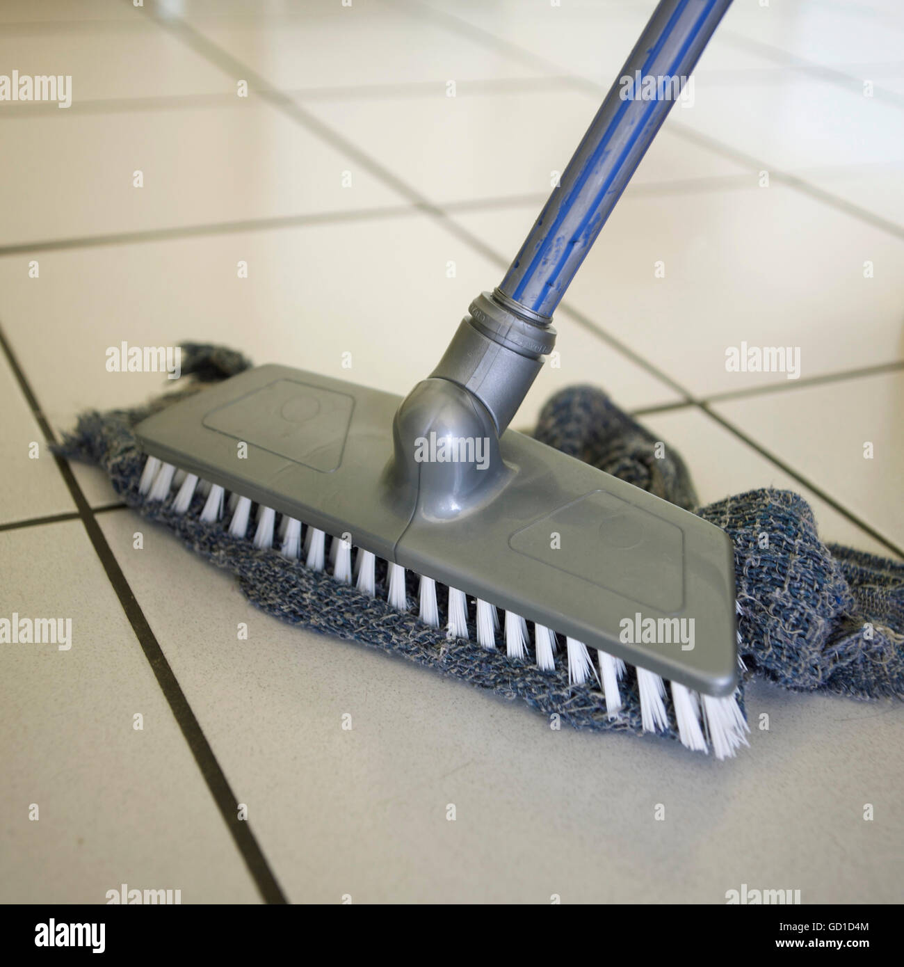 Scrubber and cloth, wiping tiled floor Stock Photo Alamy
