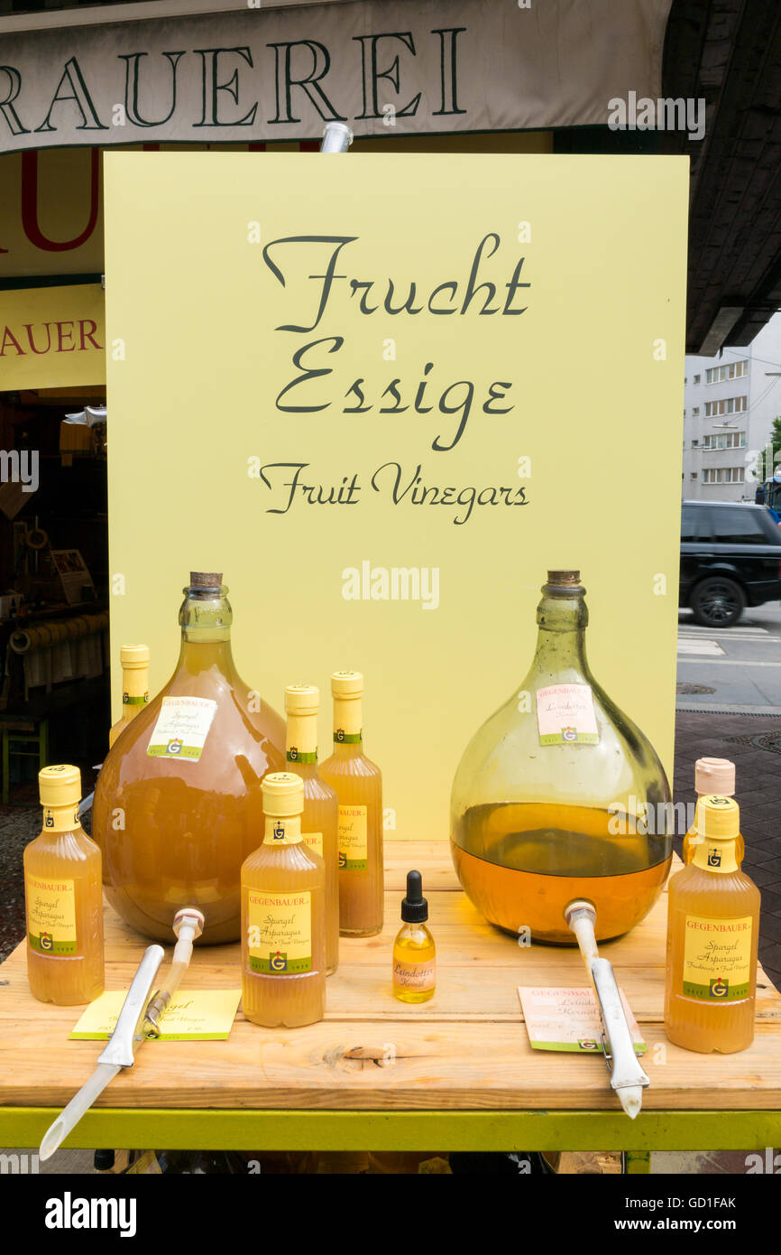 Local fruit vinegars on Naschmarkt market stand in Vienna, Austria Stock Photo
