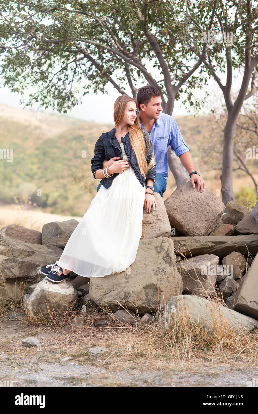 Beautiful happy smiling couple embracing outdoors Stock Photo - Alamy