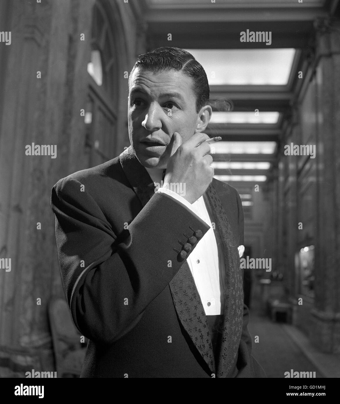 Journalist Mike Wallace, smoking a cigarette, 1953. Stock Photo