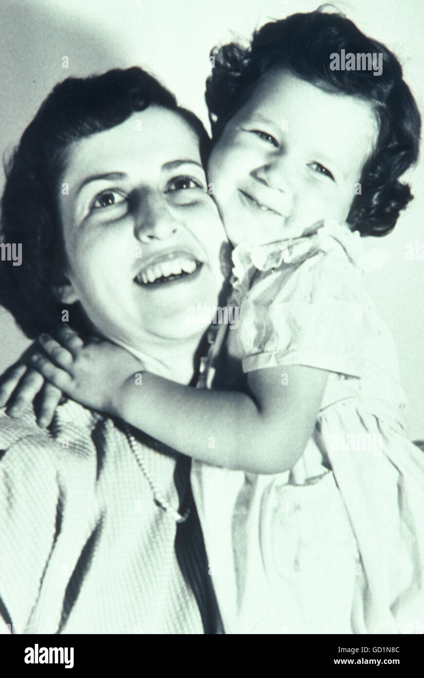 Vintage 1950's Black and White Portrait, Mother and Daughter Smiling at Camera, USA Stock Photo