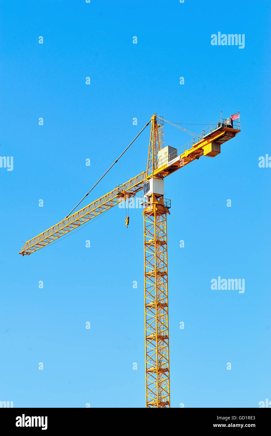 A construction crane in downtown Chicago. A high volume of new