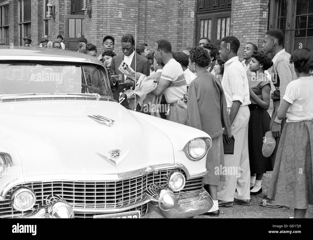 Nat King Cole signing autographs Stock Photo