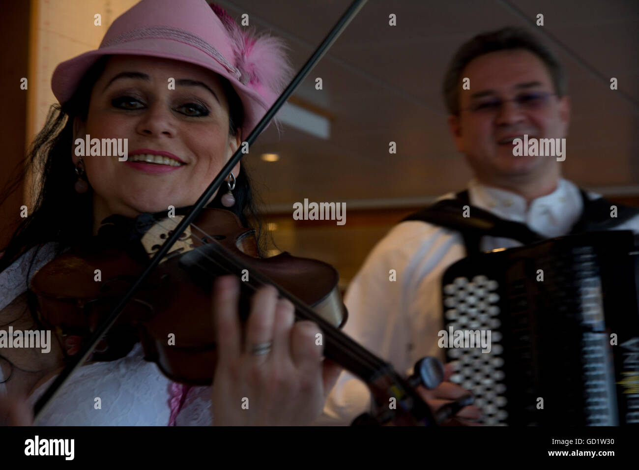 Local German entertainers perform during the 'Taste of Germany' buffet dinner onboard Viking Alruna during a recent Rhine cruise Stock Photo