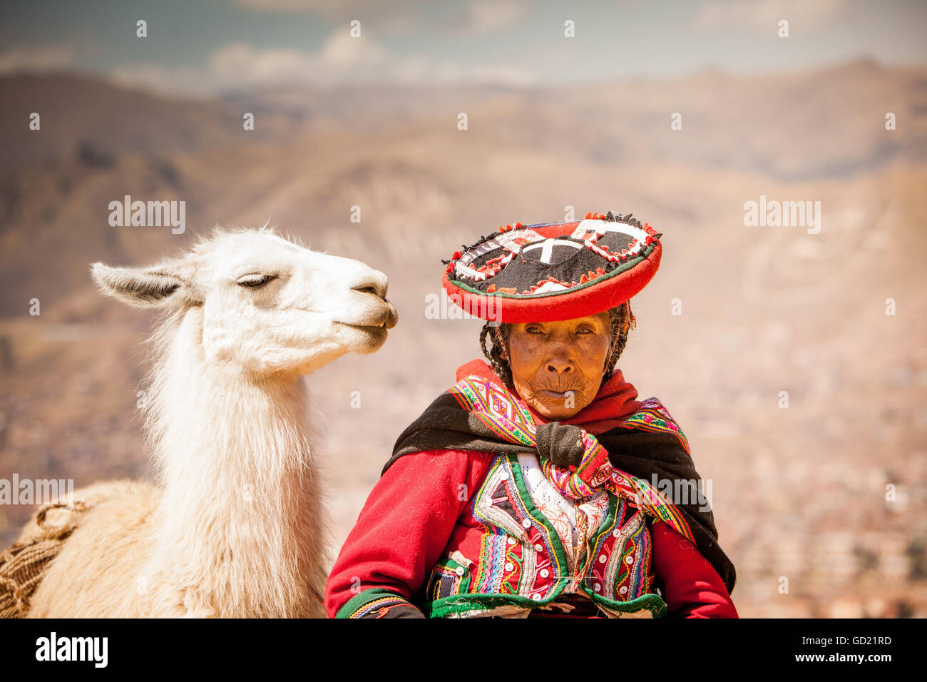 Traditional Peruvian woman and her llama, Cusco, Peru, South America Stock Photo