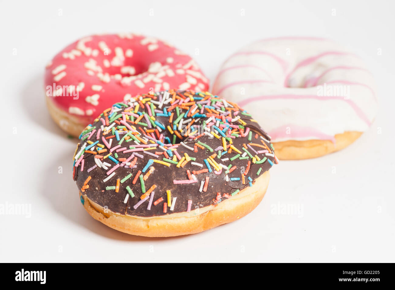 Assorted Donuts on a white background Stock Photo - Alamy