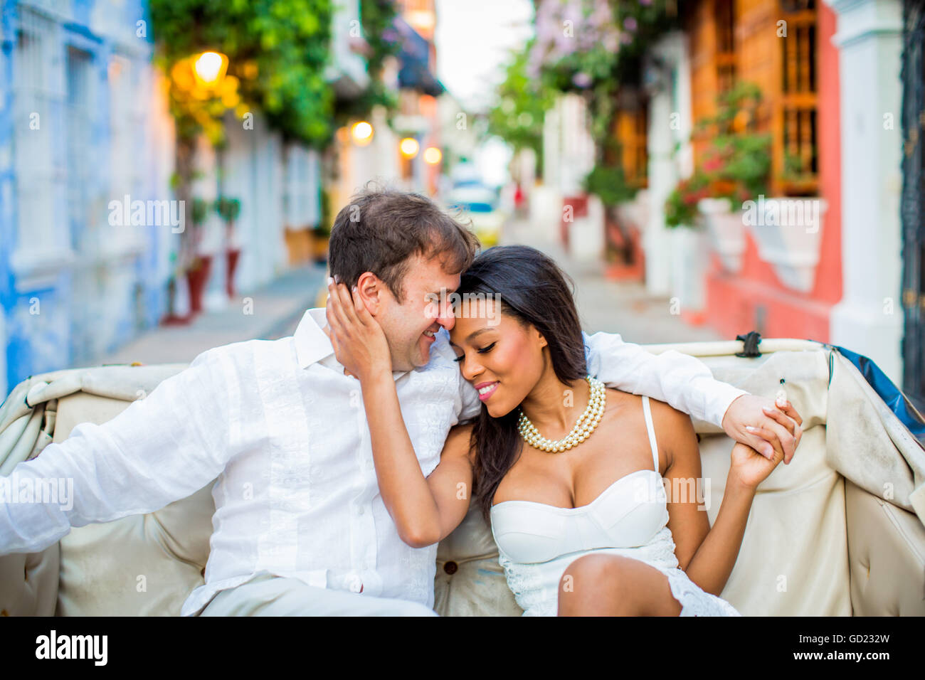 Couple sitting in a horse and carriage, Old Walled-in City, Cartagena, Colombia, South America Stock Photo